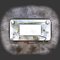 Red and Black Gas Station Fuel Pump with Yellow Warning Posts and Concrete Base