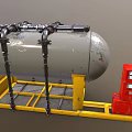 Gray Industrial Storage Tank With Black Pipes On Yellow Frame And Red Control Cabinet