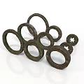 Artistic Bronze Ring Sculptures With Textured Surfaces And Stacked Design
