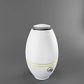 White Oval Daily Use Electric Humidifier With Yellow Stripes And Control Knob Design