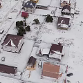 Snow Covered Houses Aerial View Winter Landscape With Brown Roofs And Trees