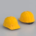 Two Yellow Hard Hats Placed On Gray Background For Construction Safety Gear
