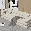 White Sectional Sofa with Plush Cube Design Cushions Striped Throw Blanket and Abstract Wall Art