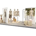 Fashion Store Display Arrangement With Multiple Mannequins Wooden Stump Bases And Clothing Racks