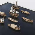 Various Traditional Wooden Boats With Sails And Oars Displayed On Water