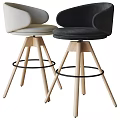 Modern Bar Stools Featuring Blue And White Upholstered Seats Wooden Legs And Black Metal Footrests