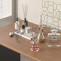 Perfume Cosmetics Display on Wooden Table with Fragrance Diffusers Candles Bottles Window Blinds and Geometric Art