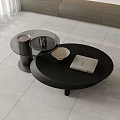 Modern Round Black Coffee Table With Glass Top Bowl Book And Cup In Living Room