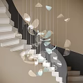 Elegant Modern Leaf Shaped Chandelier Hanging By Spiral Staircase With Silver And Light Blue Design