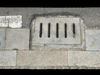 Gray Stone Pavement With Outdoor Drainage Grate And Urban Street Design 3d model