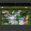 Green Trash Bin With Colorful Graffiti Stickers Rusted Surface And Black Lid