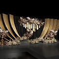 Wedding Stage Design With Golden Draped Curtains Decorative Flowers And Hanging Chandeliers