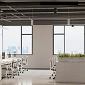 Modern Open Office Space With Workstations Monitors Potted Plants And Natural Light