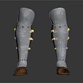 Ancient Metal Leg Armor with Silver Finish Gold Accents Leather Base and Intricate Carvings