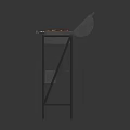 Outdoor Barbecue Grill With Meat Skewers And Orange Side Panel On Metal Stand