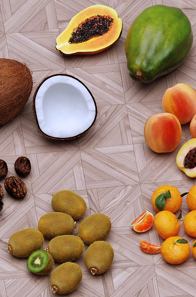 Fresh Whole And Halved Fruits Including Coconut Papaya Peach Kiwi And Orange On Table 3d model