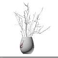 White Ceramic Vase With Red Patterns Holding Decorative Twigs And Small Beads