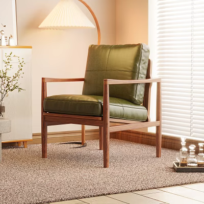 Green Leather Leisure Chair With Brown Wooden Frame And Armrests In Cozy Indoor Space 3d model