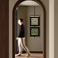 Man Walking Through Arched Doorway In Interior With Decorative Paintings