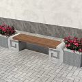 Public Bench With Wooden Seat And Concrete Base Near Colorful Flower Pots On Paved Ground