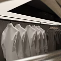 Neatly Hanging White And Gray Jackets On Clothing Rack With Metal Hangers