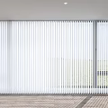 White Venetian Blinds Covering Large Windows In Bright Interior With Outdoor View