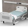 White Medical Bed With Wheels Pillow And Light Blue Bed Sheet Against Gray Wall