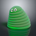 Cute Green Spiral Toy With Big Eyes And Glowing Reflective Base