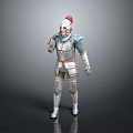Man In Medieval Full Body Armor With Red Helmet Standing Against Gray Background