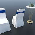 White Covered Dining Chairs With Blue Sashes And Small Round Table With Flower Decoration
