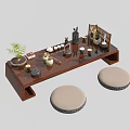 Traditional Wooden Tea Table And Round Cushioned Stools With Tea Utensils Plant And Screen