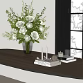 Green Glass Vase With White Flowers And Decorative Candles On Wooden Table By Window