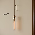Modern Minimalist Brass Pendant Light With Glass Tube Design Hanging In Interior Room