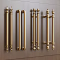 Decorative Brass Door Handles With Ornate Designs Mounted On Wooden Door Panel