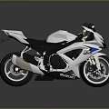White And Blue Suzuki Sports Motorcycle With Black Seat Alloy Wheels And Sporty Design