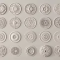 Decorative Carved Ceiling Medallions Showcasing Various Intricate Floral And Geometric Patterns