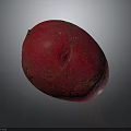 Vibrant Red Potato With Smooth Skin And Oval Shape On Dark Background