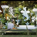 Floral Display With Green Foliage Background White Elephant Decoration And Illuminated Letters