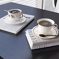 Hot Coffee In Elegant Cups On Saucers With CERAI Books On Black Table And Spoons