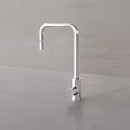 Sleek Modern Stainless Steel Faucet on Gray Countertop with Minimalist Design
