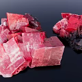 Vibrant Red Pink Rockery Stones With Crystal Structure And Shiny Surface On Black Background