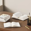 Open and Stacked Books on Wooden Table with Pen Holder and Pens