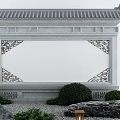 Traditional Chinese Screen Wall Featuring Gray Tiled Roof White Wall Carved Decorations Green Plants Rocks
