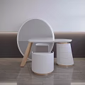 Minimalist White Dressing Table With Round Mirror And Storage Stool On Wooden Floor