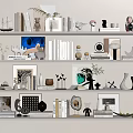 Decorative Ornament Set With Books Photo Frames Vases Sculptures And Green Plants On White Shelves