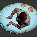 Adorable Baby Sitting on Blue Round Mat with Decorative Footprints and Flowers