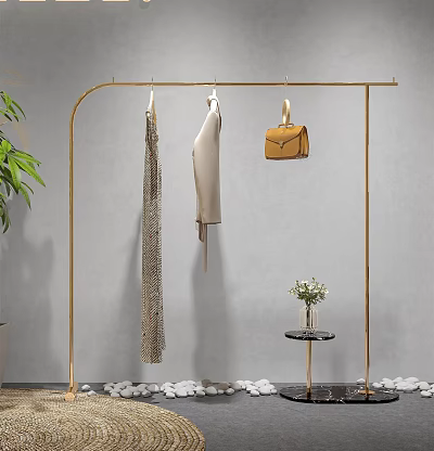 Golden Clothes Rack with Hanging Dresses Handbag Green Plant Flowers and Pebbles on Gray Wall 3d model