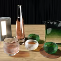 Refreshing Pink Beverage in Glass Bottles and Cups on Wooden Table with Green Glassware