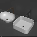 Modern White Oval and Square Washbasins with Gold Silver Handles on Grey Countertop