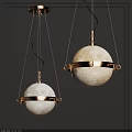 Modern Moon Surface Pendant Lights With Gold Metal Rings On Black Background